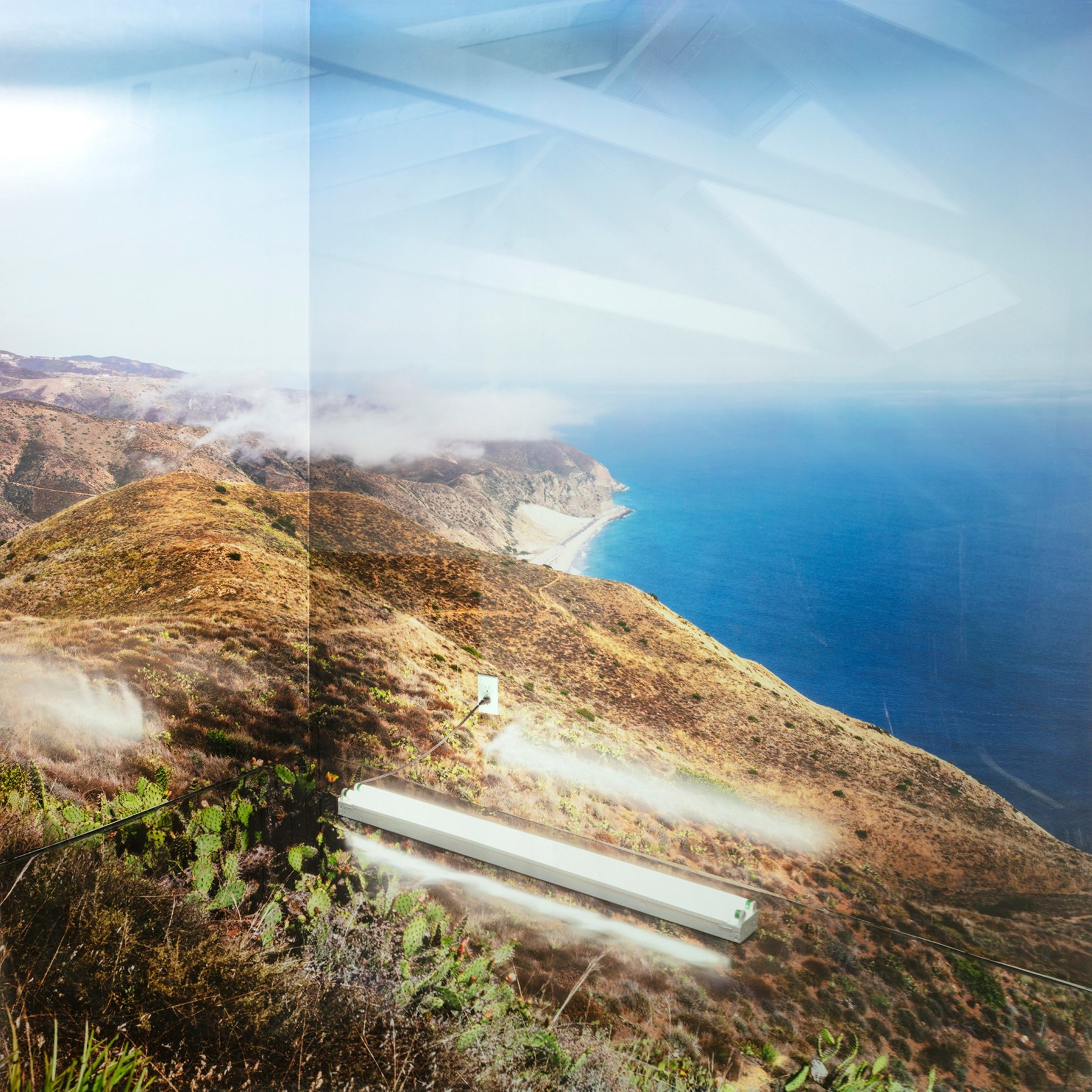 Photograph of Point Mugu with an overlay of a photograph of a ceiling sculpted within the perspective of a corner in a room