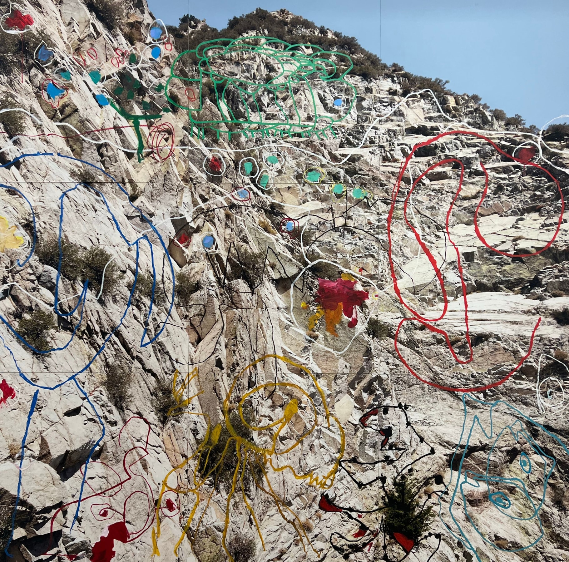 Photograph of a mountain with paint overlay separated on nine panels