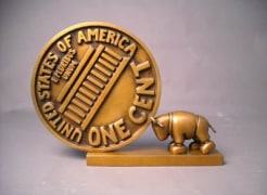 Bull Pushing Penny