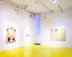 Installation view, yellow painted floor