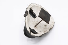 Jaque Sagan's ceramic mask, view of the back showing signature and wall mounting element