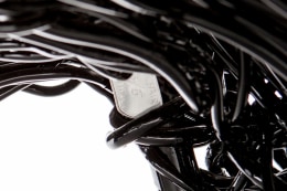 Forrest Myers' Wingback chair, detailed view of metal tag with title and signature
