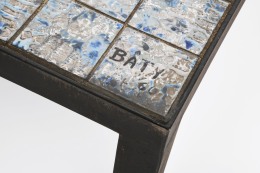 Baty's ceramic coffee table, detailed diagonal view of table top showing signature on corner