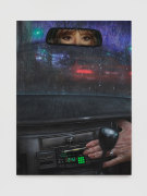 woman's eyes in the rearview mirror with stereo clock