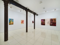 Installation view of Bill Jensen's Wandering Boundless and Free featuring colorful, abstract paintings