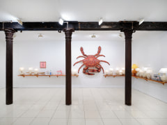 Installation view of Zachary Armstrong: New Work, featuring crab sculpture, lamps, and sewing machine sculptures by Zachary Armstrong