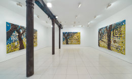 Installation view of Julian Schnabel plate paintings of trees