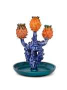 Lola Montes ceramic candelabra with green base, blue stems, and three orange artichoke-shaped tops