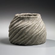 Flattened vase with raised mouth decorated with diagonally carved rippling patterning, ca. 1995