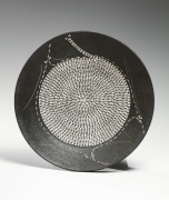 Textured black-glazed stoneware platter with impressed abstract floral patterning and white slip inlay, 1982