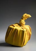Yellow sculpture in the shape of knotted furoshiki (wrapping cloth)&nbsp;enclosing a large square storage box, 2020