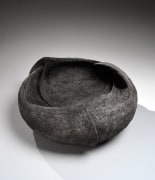 Carved vessel with striated patterning