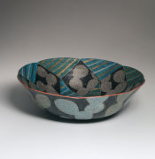 Large foliated bowl decorated with two birds against silver background with cactus patterning in silver, ca. 1988