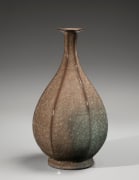 Faceted vase with crane neck, flared mouth, raised foot and beishoku (rice-colored) craquelure celadon glaze with red-blush kiln effects, 2019