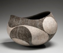 Dark blackish-brown rounded vessel with wide open mouth and curvilinear patterning in silver slip, 2019