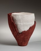 Torn red conical vessel revealing inserted white form, 2021