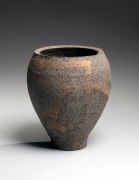 Dark gray round vessel on a raised foot, decorated with acid-etched striated patterning in light brown, 1967