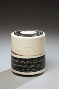Textured lidded cylinder box with rouletted patterning and white slip inlay, Textured black glazed stoneware, white slip inlay