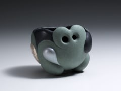 Green and black-glazed carved teabowl with silver leaf in scalloped patterning, 2017