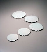Set of five graduated bluish-white porcelain scalloped-edge plates, 2005