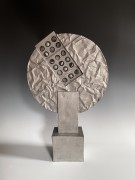 Standing sculpture of a round screen with rectangular perforated inset panel&nbsp;of rotating hemispherical elements on a square base, 1990