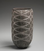 Charcoal gray columnar vessel with curving interlaced patterning in silver slip, 2019