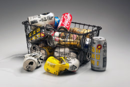 Metal shopping basket with 15 separate beer and soda cans, 2012