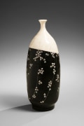 Elongated ovoid vase with rouletted and stamped floral patterning accentuated with white slip inlay, ca. 1979
