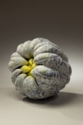 Biomorphic sculpture in the form of a hand-of-the-Buddha with layers of white and yellow matte glazes over black glaze, 2011