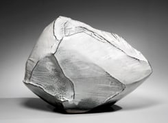 Rock-like, horizontal, scooped-out vessel with multi-planed body and unctuous white Hagi glazes, 2018