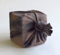 Brown and black sculpture in the shape of furoshiki (wrapping cloth) wrapping a square box, 2017&nbsp;