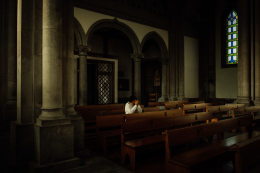 Ana Maria Jeremias praying at Igreja Nova de Sao Jose,just before going to meet her granddaughters after school. Fafe, Portugal, 2024