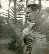 Chuck Howard (behind leaves), n.d.