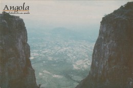 A postcard Ana Maria Jeremias kept from an Angolan mountain landscape, where the phrase &#039;Angola: The Reality of a Dream&#039; can be read, 2024