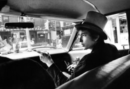 Bob Dylan with Top Hat Pointing in Car, Philadelphia, PA, 1964