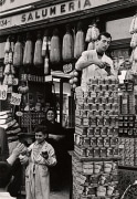 Stacking Tins on the Street, Naples, 1961, 11-3/8 x 7-13/16 Vintage Silver Gelatin Photograph