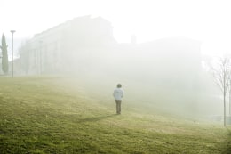 Ana Maria Jeremias disappearing into the smoke of a fire on the morning she arrived in Fafe, just before going to meet her granddaughters after school. Fafe, Portugal, 2024