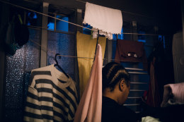 At dawn, Ana Maria Jeremias washes laundry for one of the families she works for in the Lapa neighborhood, the most expensive area of the city. Lisbon, Portugal, 2024