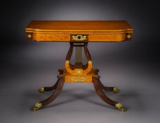Card Table with Lyre Base, about 1815. Philadelphia. Mahogany, with gilt-brass paw toe caps and castors, strings for the lyres, and gilt-brass and ormolu mounts 28 1/2 in. high, 35 in. wide, 17 1/2 in. deep (at the top), 18 in. deep (at the castors)