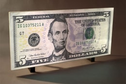 Federal Reserve Note Five Dollars, 2009. Aqua resin, gesso and video projection, 41.75 x 96.5 inches (103.5 x 242.6 cm). MP 582