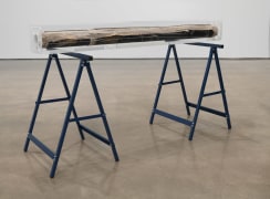 Alterity Line, 2002-2017. Oil paint on cotton canvas, laser etching on Plexiglas, and 2 Brennenstuhl sawhorses in blue, 35 1/8 x 62 x 6 3/4 inches (89.2 x 157.5 x 17.1cm).