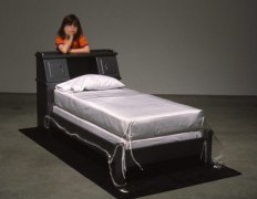 The bed Neil Armstrong slept in his first night back from the moon, 1969-1998. Wooden headboard and bed frame, mattress, box springs, pillow, pillow case, 