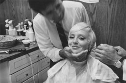 Beauty salon client with a new haircut, Detroit, 1968