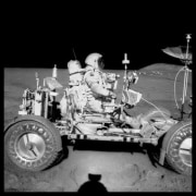 David Scott Drives the First Lunar Rover; Note Aerial Navigation Photographs; Photographed by James Irwin, Apollo 15, July 26-August 7, 1971