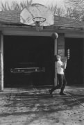 Boy playing basketball, Detroit, 1968