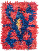 bright red konya tulu stringy shag rug. the design features a spider-like motif in the center