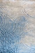 blue and beige rug depicting gentle ripples on still water