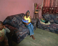 Deana Lawson,&nbsp;Woman with Child, 2017. Pigment print, 55 x 68 inches.