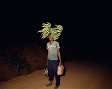 Deana Lawson. Walking Home on Some Road, Gemena, DR Congo, 2015. Inkjet print mounted on sintra, 36 x 45 inches, edition 1/3.