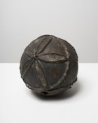 This is an image of a bronze sculpture made by Ruth Vollmer in 1964-66 titled: Wounded Sphere.
